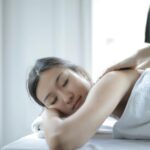 photo of woman getting a back massage