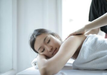 photo of woman getting a back massage