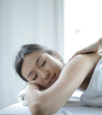 photo of woman getting a back massage