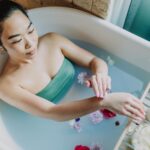 woman in blue tube dress in bathtub