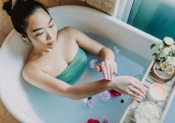 woman in blue tube dress in bathtub