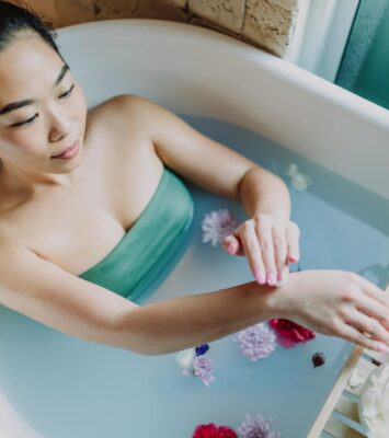 woman in blue tube dress in bathtub